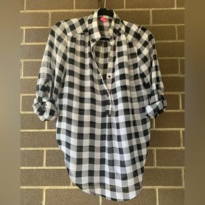 Black and white checkered shirt.